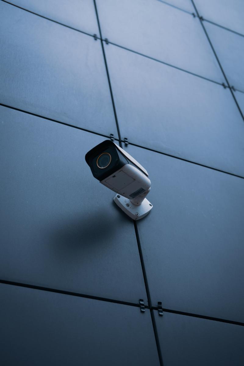 CCTV camera on dark building cladding