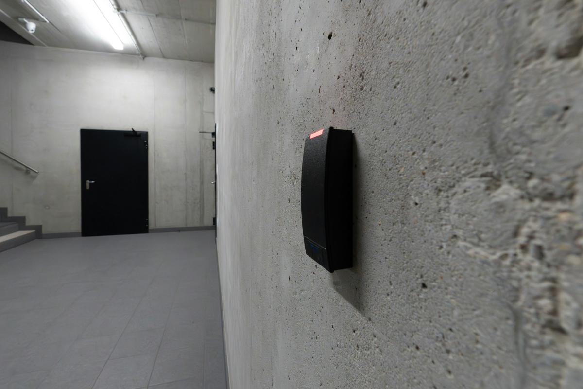 Access control card reader beside a door